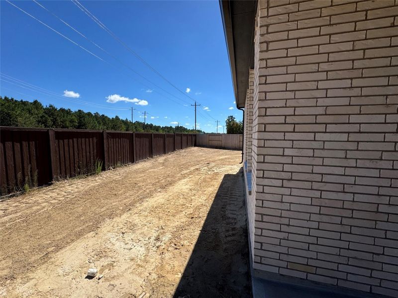 Exterior details and patio area of a home in The Trails, New Caney (Image 23). Exterior details and patio area of a home in The Trails, New Caney (Image 23).