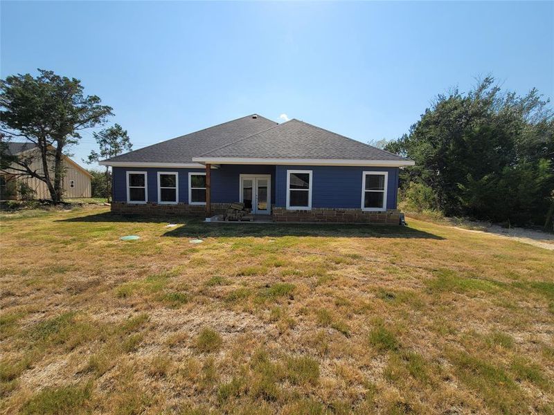 Ranch-style home with a front yard