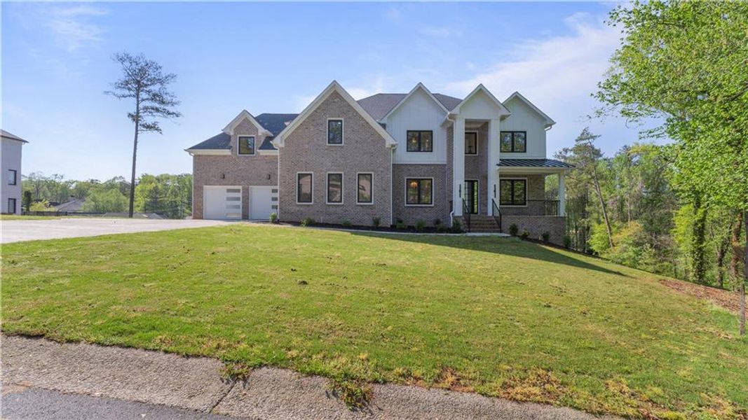 Front exterior of a new home in , Marietta, GA, highlighting curb appeal (Image 1). Front exterior of a new home in , Marietta, GA, highlighting curb appeal (Image 1).