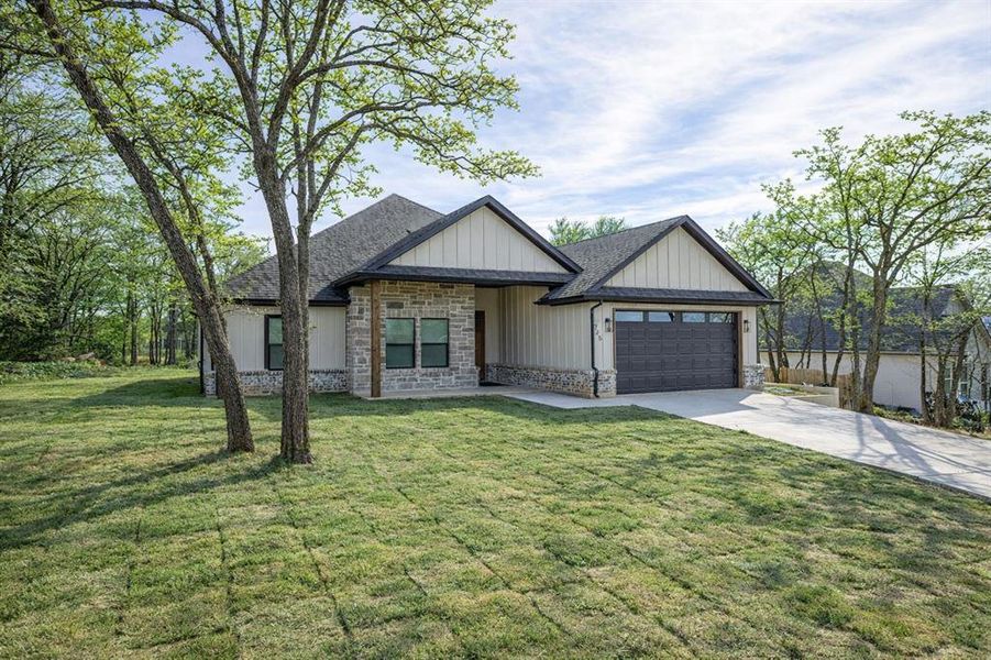 Front exterior of a new home in , Runaway Bay, TX, highlighting curb appeal (Image 28). Front exterior of a new home in , Runaway Bay, TX, highlighting curb appeal (Image 28).