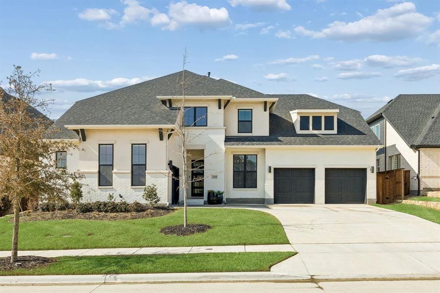 Front exterior of a new home in Walsh Ranch 70', Fort Worth, TX, highlighting curb appeal (Image 1). Front exterior of a new home in Walsh Ranch 70', Fort Worth, TX, highlighting curb appeal (Image 1).