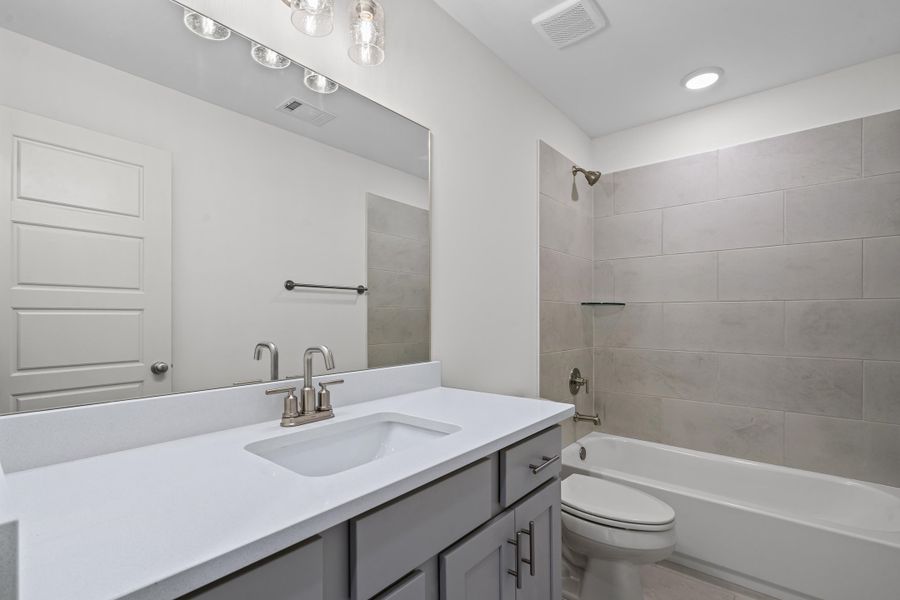 Full bath with shower / bathtub combination and vanity