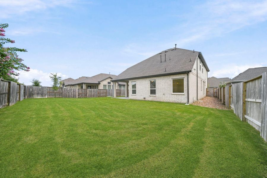 Enjoy the outdoors in this spacious and low-maintenance backyard! With plenty of room for play, gardening, or relaxing, this private outdoor space is the perfect blank canvas to make your own.