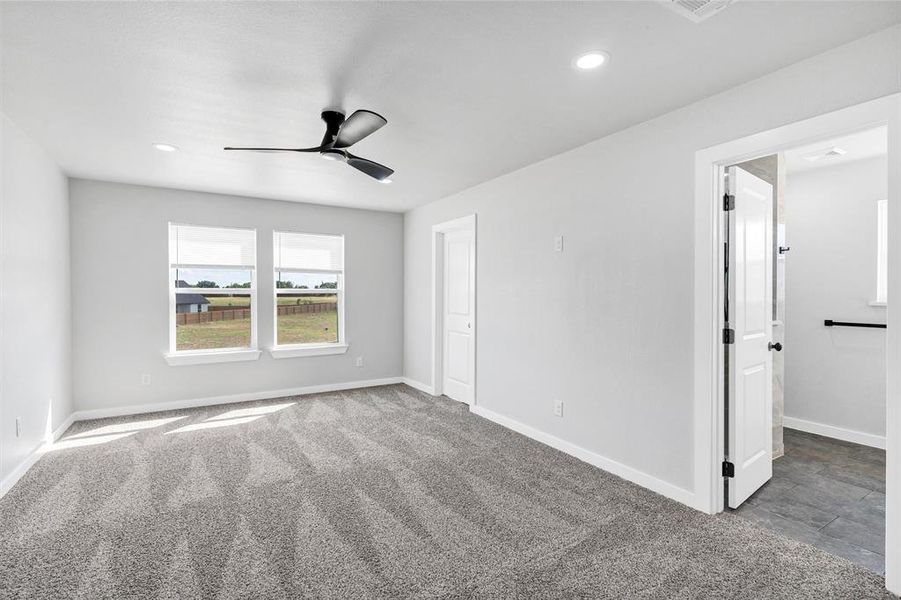 Unfurnished bedroom featuring recessed lighting, baseboards, and carpet flooring