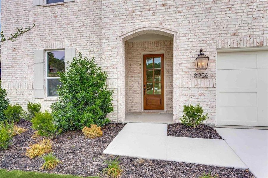 Entrance to property featuring a garage