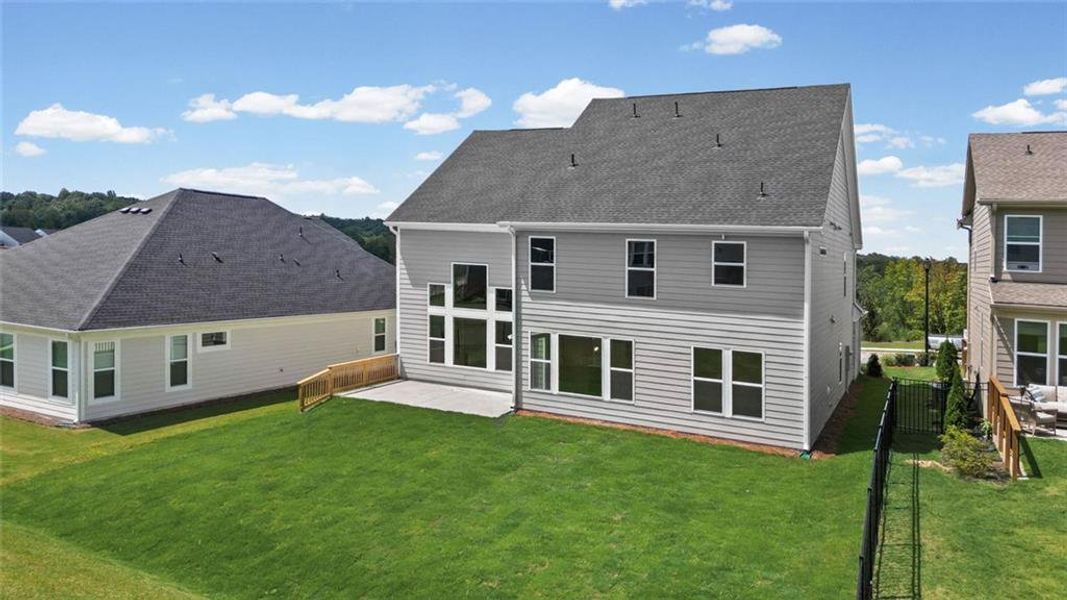 Exterior details and patio area of a home in Twin Lakes, Hoschton (Image 26).