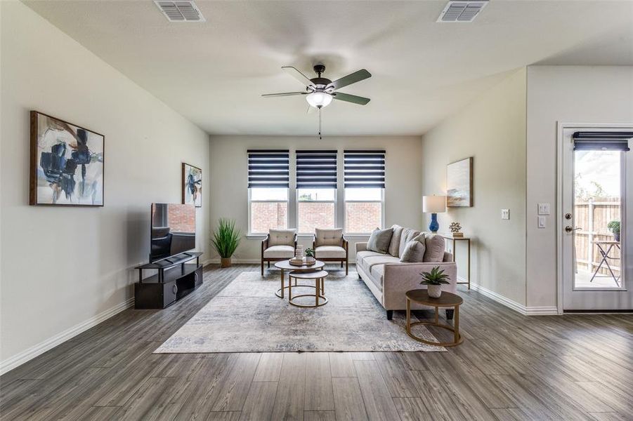 Open floor plan with living room and door to outside covered patio Open floor plan with living room and door to outside covered patio