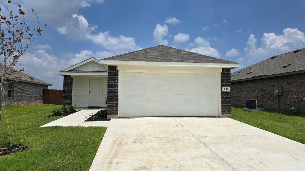 Front exterior of a new home in The Canyons, Keene, TX, highlighting curb appeal (Image 1). Front exterior of a new home in The Canyons, Keene, TX, highlighting curb appeal (Image 1).