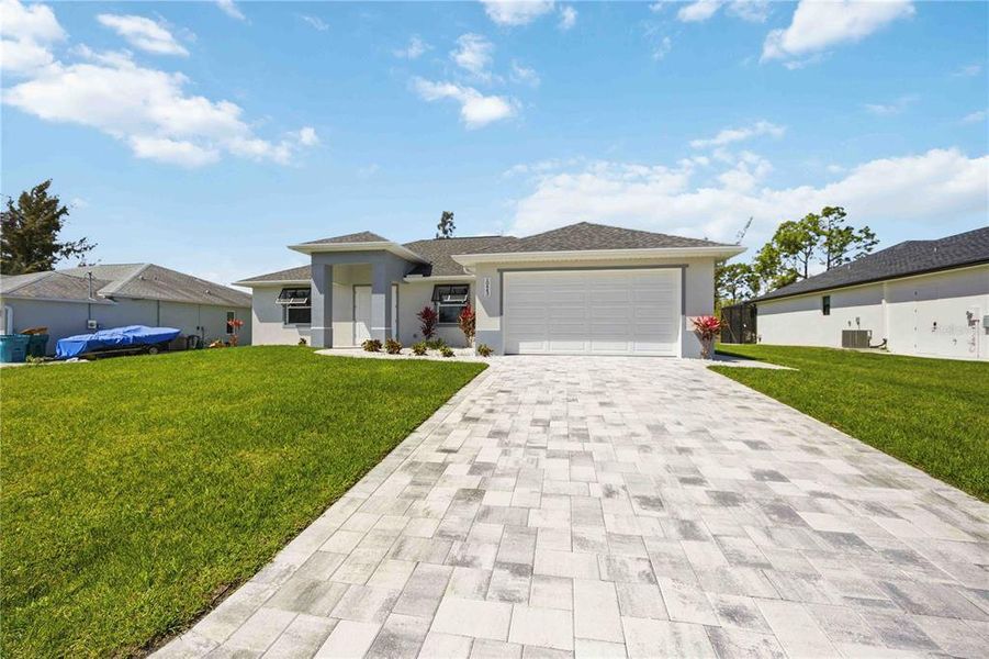 Front exterior of a new home in , Port Charlotte, FL, highlighting curb appeal (Image 26).