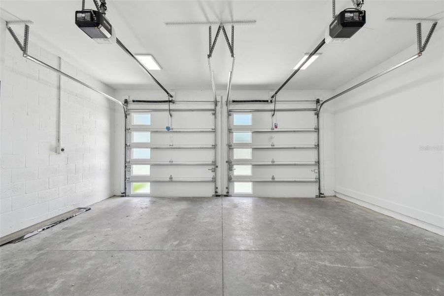 Insulated garage door & electric car outlet for charging station