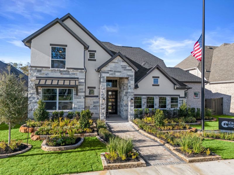 Front exterior of a new home in Riceland, Mont Belvieu, TX, highlighting curb appeal (Image 24). Front exterior of a new home in Riceland, Mont Belvieu, TX, highlighting curb appeal (Image 24).