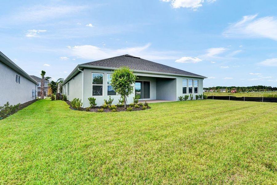 Front exterior of a new home in Ardisia Park, New Smyrna Beach, FL, highlighting curb appeal (Image 26).