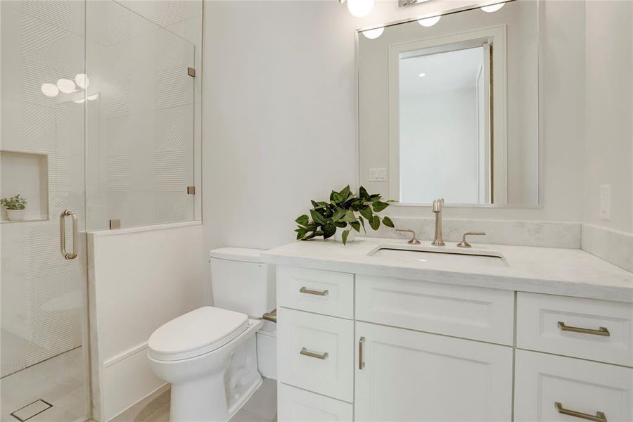 This 1st Floor Full Bath is accessible through a hidden door in the Home Office/5th Bedroom.