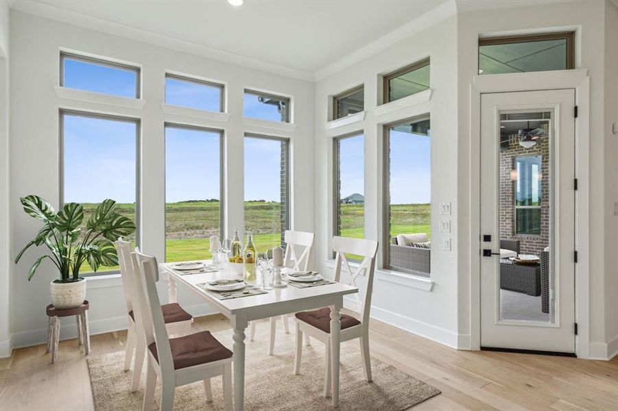 breakfast nook with lots of natural light off of the kitchen *VIRTUAL STAGING