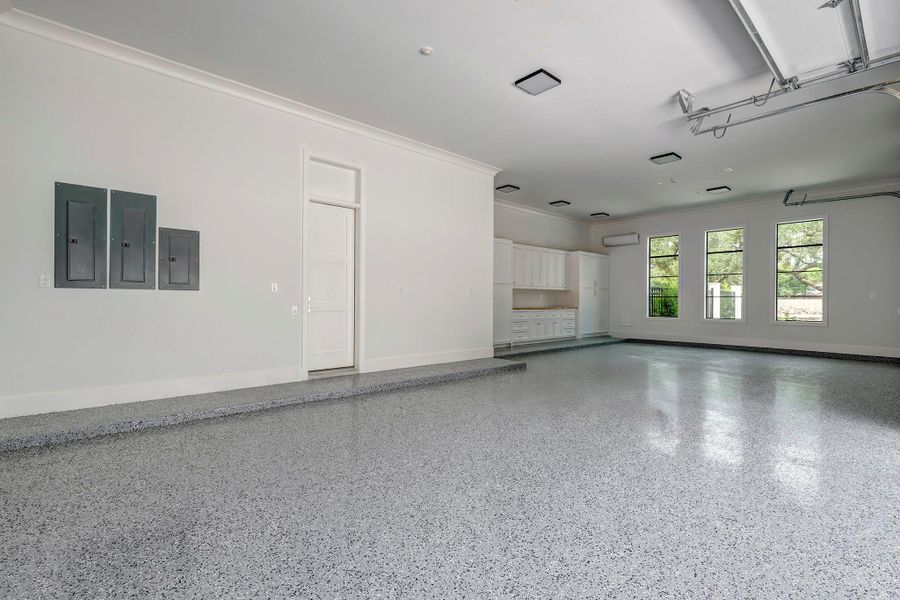 4 car garage with built in storage and epoxy floor.