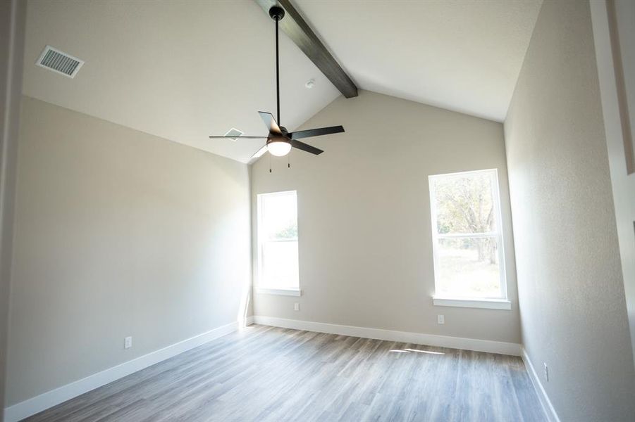 Spare room featuring light wood-type flooring and ceiling fan Spare room featuring light wood-type flooring and ceiling fan