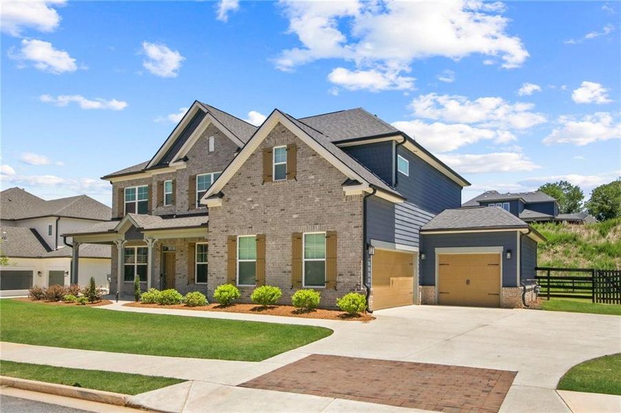 Front exterior of a new home in Carmichael Farms, Canton, GA, highlighting curb appeal (Image 24). Front exterior of a new home in Carmichael Farms, Canton, GA, highlighting curb appeal (Image 24).