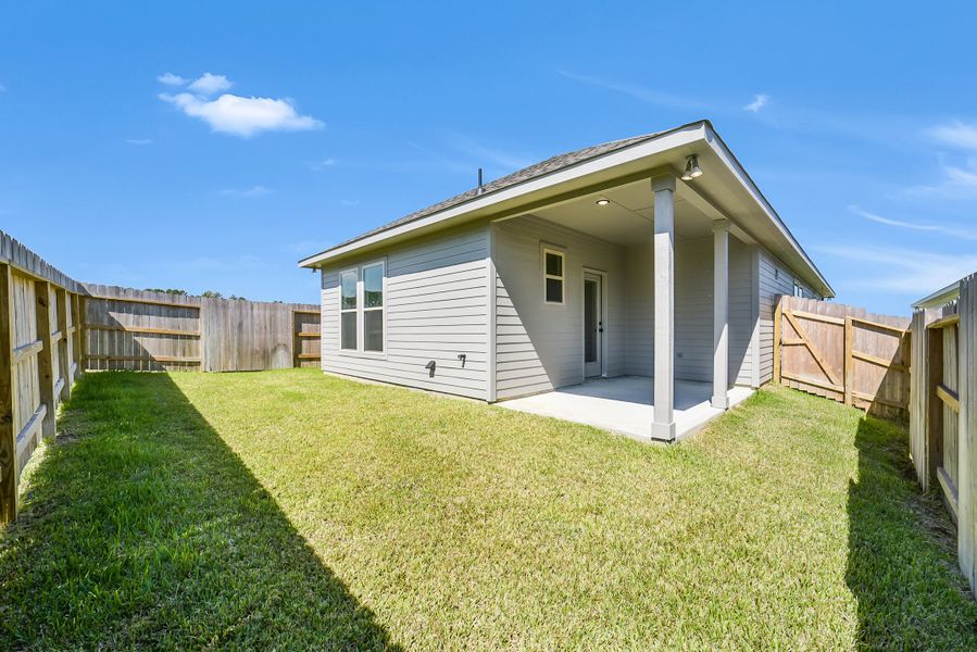 Exterior details and patio area of a home in Mostyn Springs, Magnolia (Image 26).