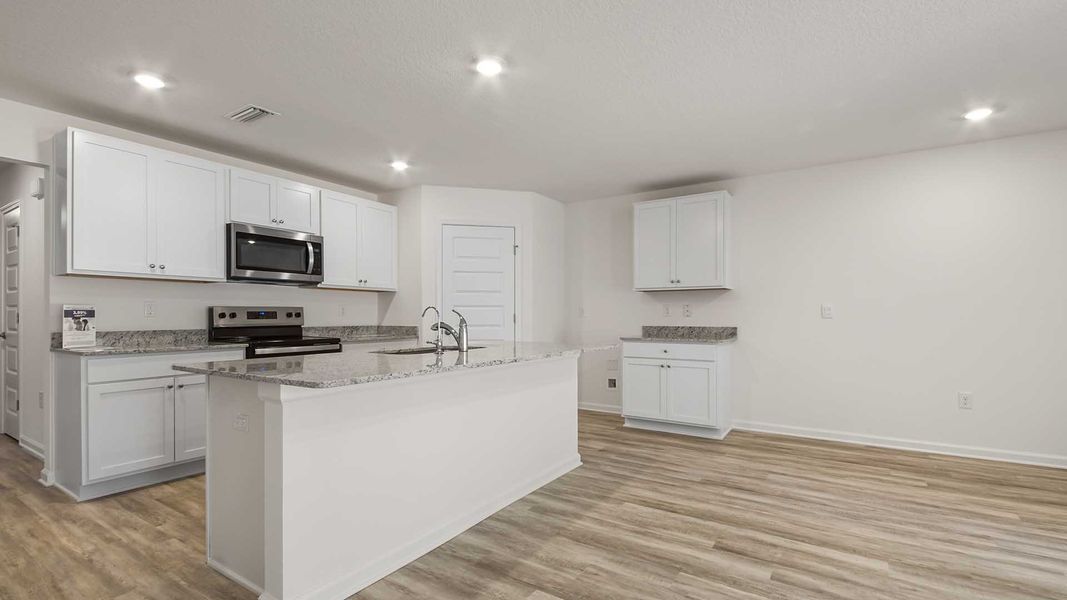 Furnished interior view inside a new home in Ashton Park Phase III, Freeport (Image 7).