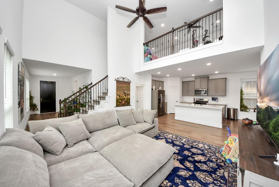 Spacious living room with soaring ceilings and open-concept layout.
