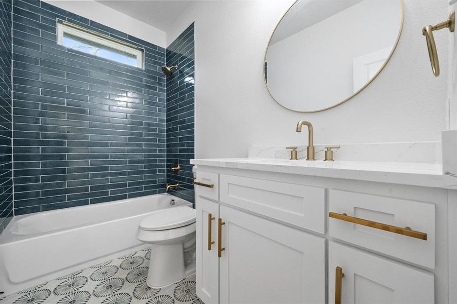 Full bath with toilet, shower / tub combination, tile patterned flooring, and vanity