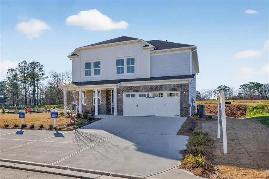 Front exterior of a new home in Linden Grove, Powder Springs, GA, highlighting curb appeal (Image 25).