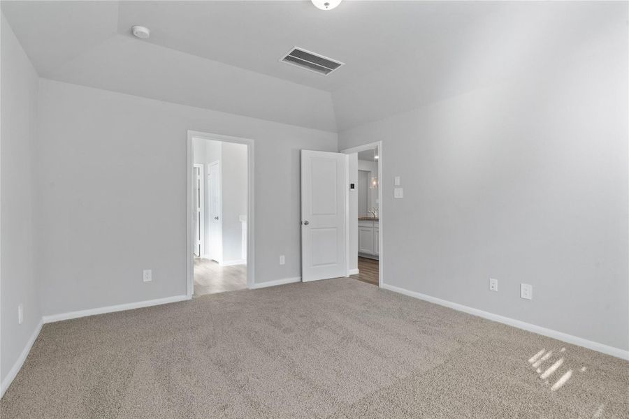 The private primary suite efficiently connects the sleeping area with the dedicated bathroom and generous closet. The private primary suite efficiently connects the sleeping area with the dedicated bathroom and generous closet.