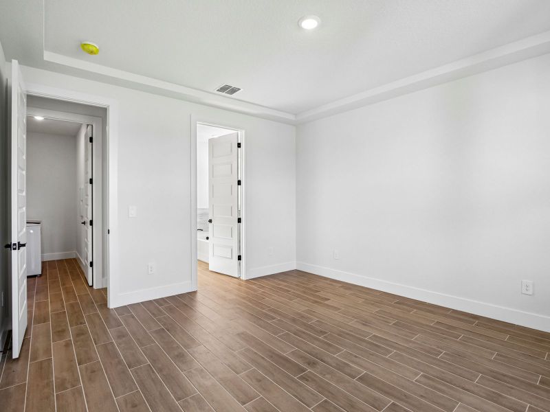 Spacious, unfurnished interior of a new home in Magnolia Bay - Reserve Series, Nokomis (Image 18).