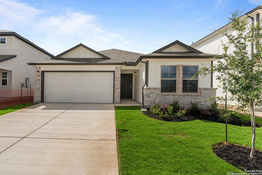 Front exterior of a new home in Meadows at Clear Springs, New Braunfels, TX, highlighting curb appeal (Image 16). Front exterior of a new home in Meadows at Clear Springs, New Braunfels, TX, highlighting curb appeal (Image 16).