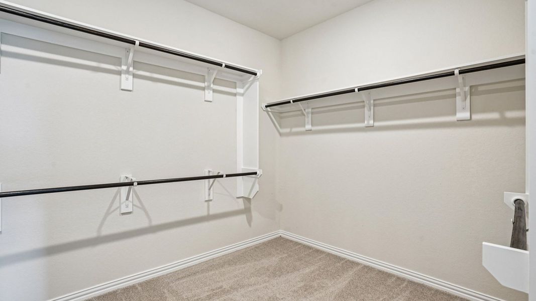 Spacious Owner's Closet with Built-in Shelving