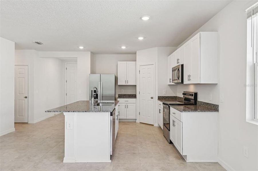 Furnished interior view inside a new home in Bradbury Creek - Signature Series, Haines City (Image 9).