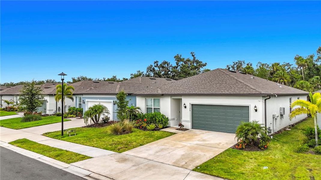 Front exterior of a new home in , Ellenton, FL, highlighting curb appeal (Image 23). Front exterior of a new home in , Ellenton, FL, highlighting curb appeal (Image 23).