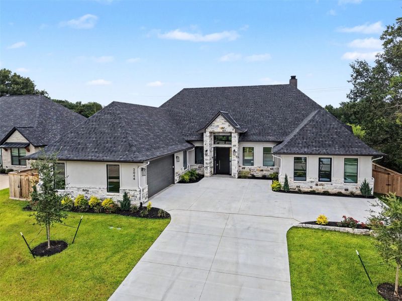 Front exterior of a new home in , College Station, TX, highlighting curb appeal (Image 2). Front exterior of a new home in , College Station, TX, highlighting curb appeal (Image 2).