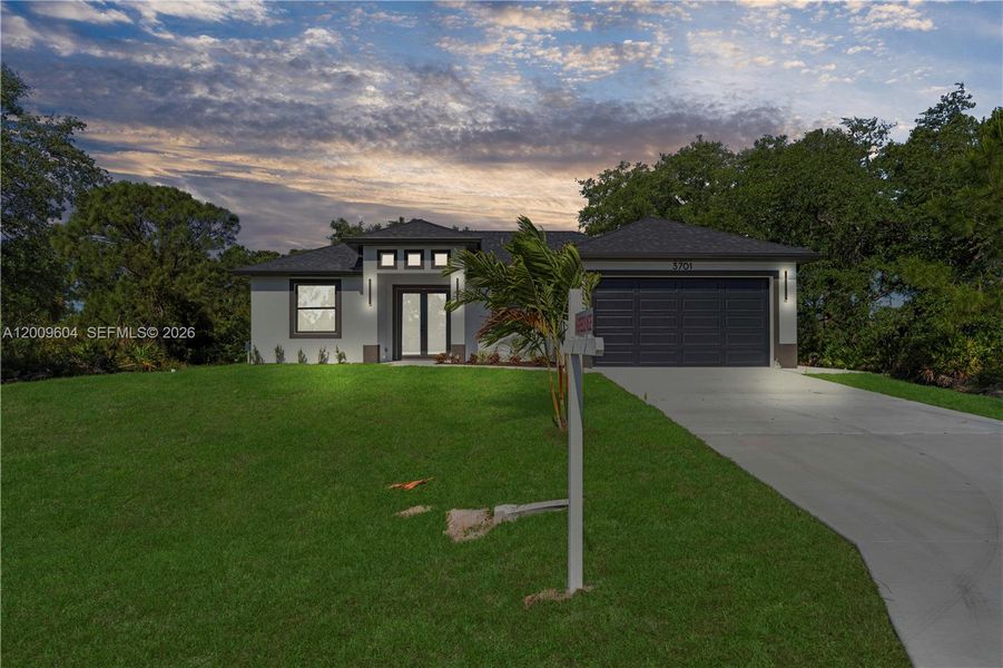 Front exterior of a new home in , Lehigh Acres, FL, highlighting curb appeal (Image 22).