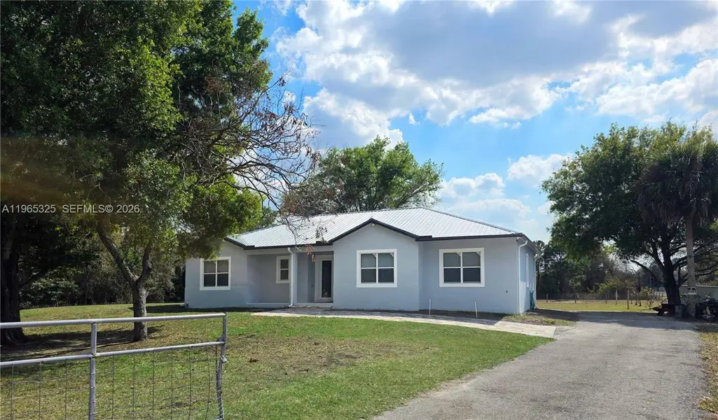 Front exterior of a new home in , Clewiston, FL, highlighting curb appeal (Image 24).