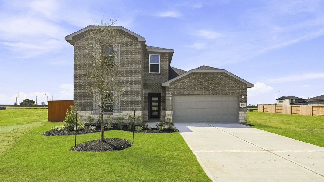 Front exterior of a new home in Sunterra Lakes, Brookshire, TX, highlighting curb appeal (Image 1). Front exterior of a new home in Sunterra Lakes, Brookshire, TX, highlighting curb appeal (Image 1).