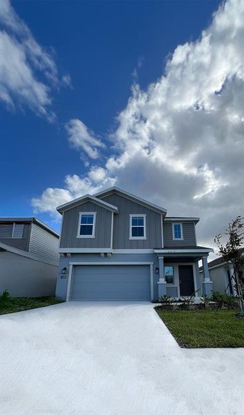 Front exterior of a new home in , Winter Haven, FL, highlighting curb appeal (Image 19).