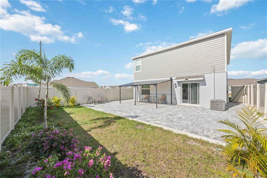 Exterior details and patio area of a home in Peace Creek Reserve: Manor Key Collection, Winter Haven (Image 35).