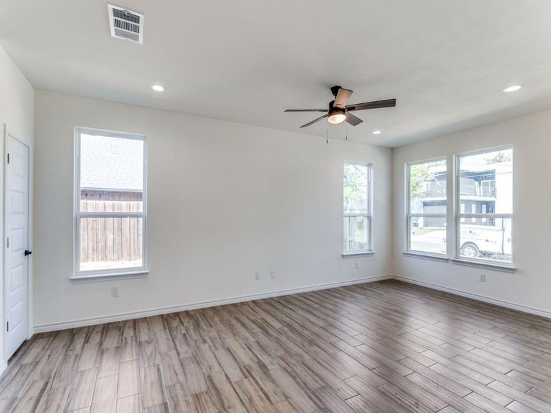 Empty room featuring light hardwood / wood-style floors and ceiling fan