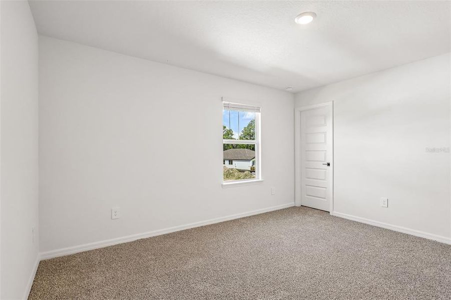 Spacious, unfurnished interior of a new home in The Grove at Stuart Crossing - Signature Series, Bartow (Image 39).