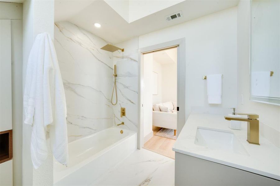 Bathroom with vanity, shower / bathing tub combination, and wood-type flooring