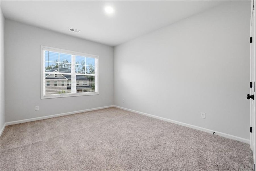Spacious, unfurnished interior of a new home in The Stables at Ewing Chapel, Dacula (Image 26).