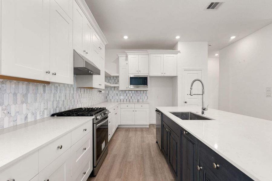 Furnished interior view inside a new home in Sunterra, Katy (Image 8).