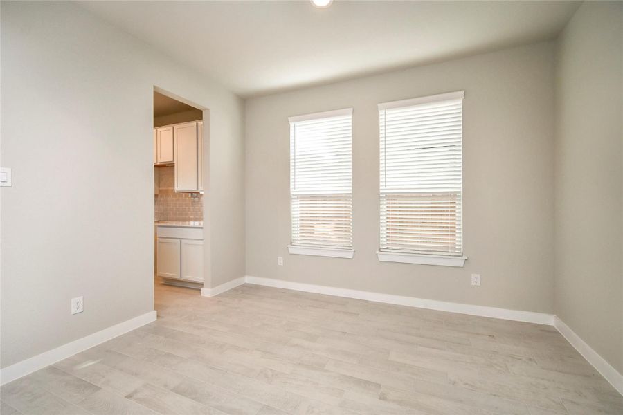Craft enduring memories with loved ones around the table! This roomy dining area boasts stylish flooring, personalized paint, and is conveniently situated next to the family room and kitchen. Sample photo of completed home with similar floor plan. Actual colors and selections may vary. Craft enduring memories with loved ones around the table! This roomy dining area boasts stylish flooring, personalized paint, and is conveniently situated next to the family room and kitchen. Sample photo of completed home with similar floor plan. Actual colors and selections may vary.