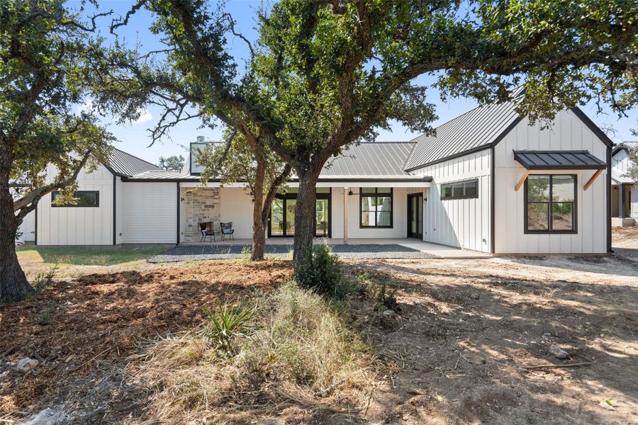 Private backyard retreat with a covered patio and tranquil greenbelt views.