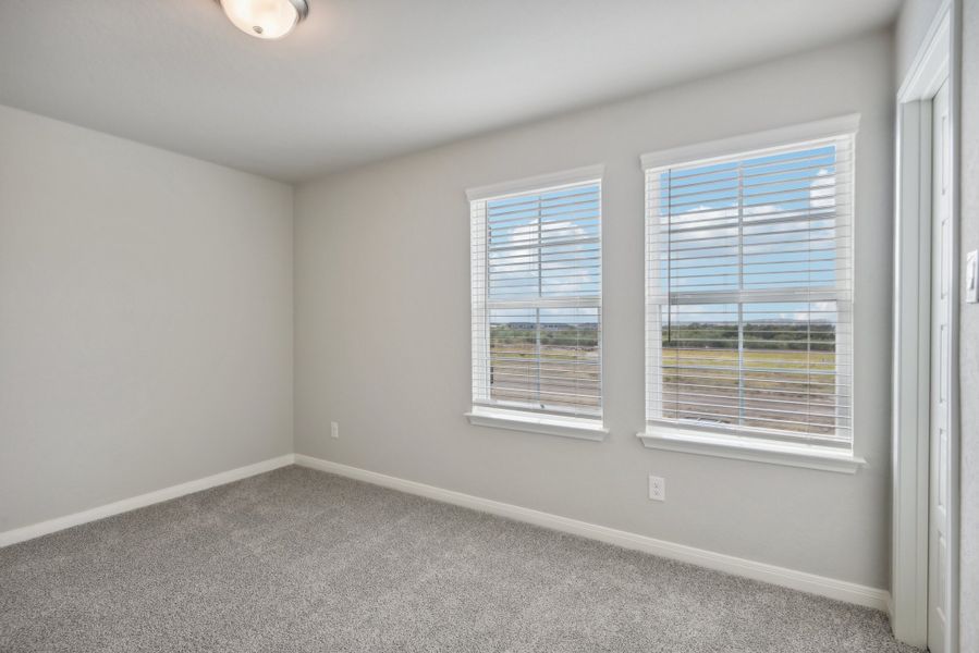 Guest bedroom in the Medina floorplan at a Meritage Homes community.