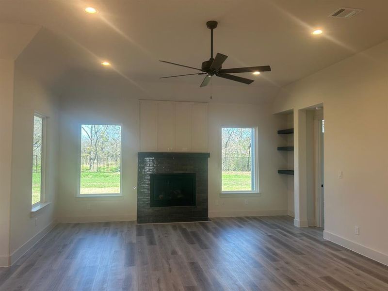 Large living room with 11-ft ceilings and gas fireplace