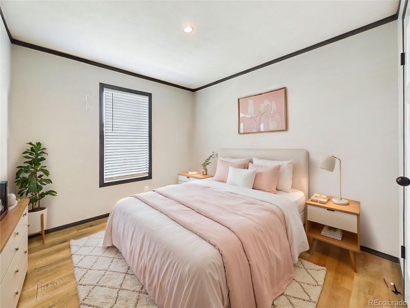 (Virtually Staged) – Comfortable bedroom 4 layout showcasing space for a full furniture set, highlighted by soft natural light and a clean design.