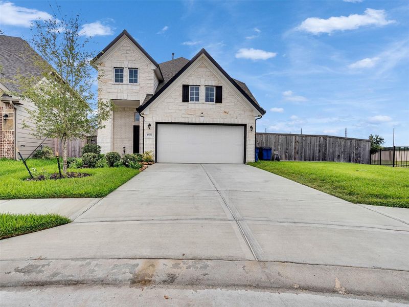 Front exterior of a new home in Park Lakes East, Humble, TX, highlighting curb appeal (Image 21).