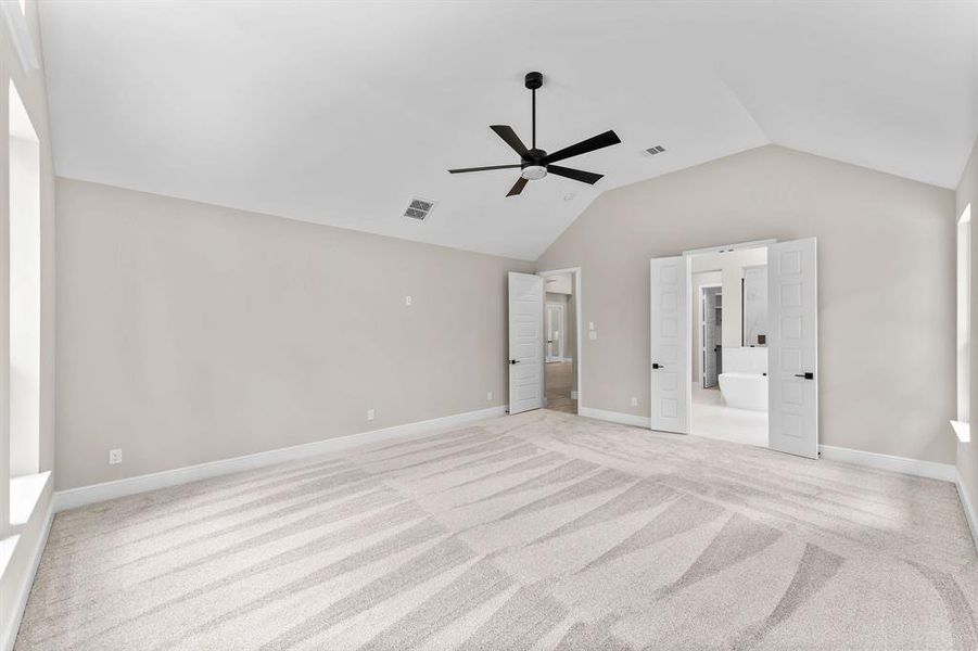 Primary bedroom with high ceilings and ceiling fan; pre-wired for security keypad